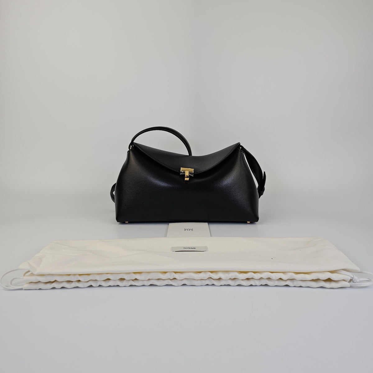 TOTEME T-Lock Black/Gold Leather Clutch New